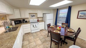 Condo, Multiple Beds, Balcony, Garden View | Private kitchen | Fridge, microwave, oven, stovetop