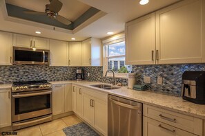 Fridge, microwave, oven, stovetop - Waterfront Royal Pelican 2B/2B Island Condo. Pool. Pickleball. Short Walk to Beach (Fort Myers Beach)