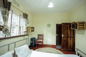 Standard Room, 1 Queen Bed, City View | Individually decorated, individually furnished, laptop workspace - Janibichi adventures hostel  (Moshi)