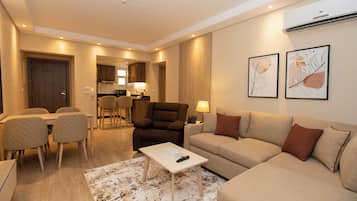 Superior Apartment | Living area | 40-inch Smart TV with digital channels