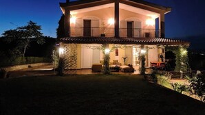 A two-story house with a balcony and a covered porch. - Neo Classic Villa: Garden, Playground & Biodesign Pool (tirane)
