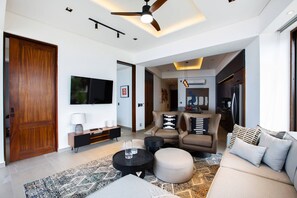 Sink into the inviting sofa, where relaxation meets elegance. - Oceanview Luxury: 2 BR in Amapas w/ Rooftop Pool (Puerto Vallarta)