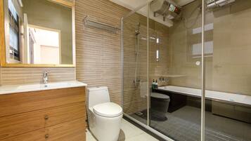 Shower, hair dryer, towels, shampoo