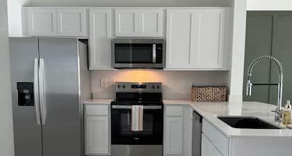 Town House + Garage, located nearby Beachwalk Lagoon + Hub of St John’s Dining