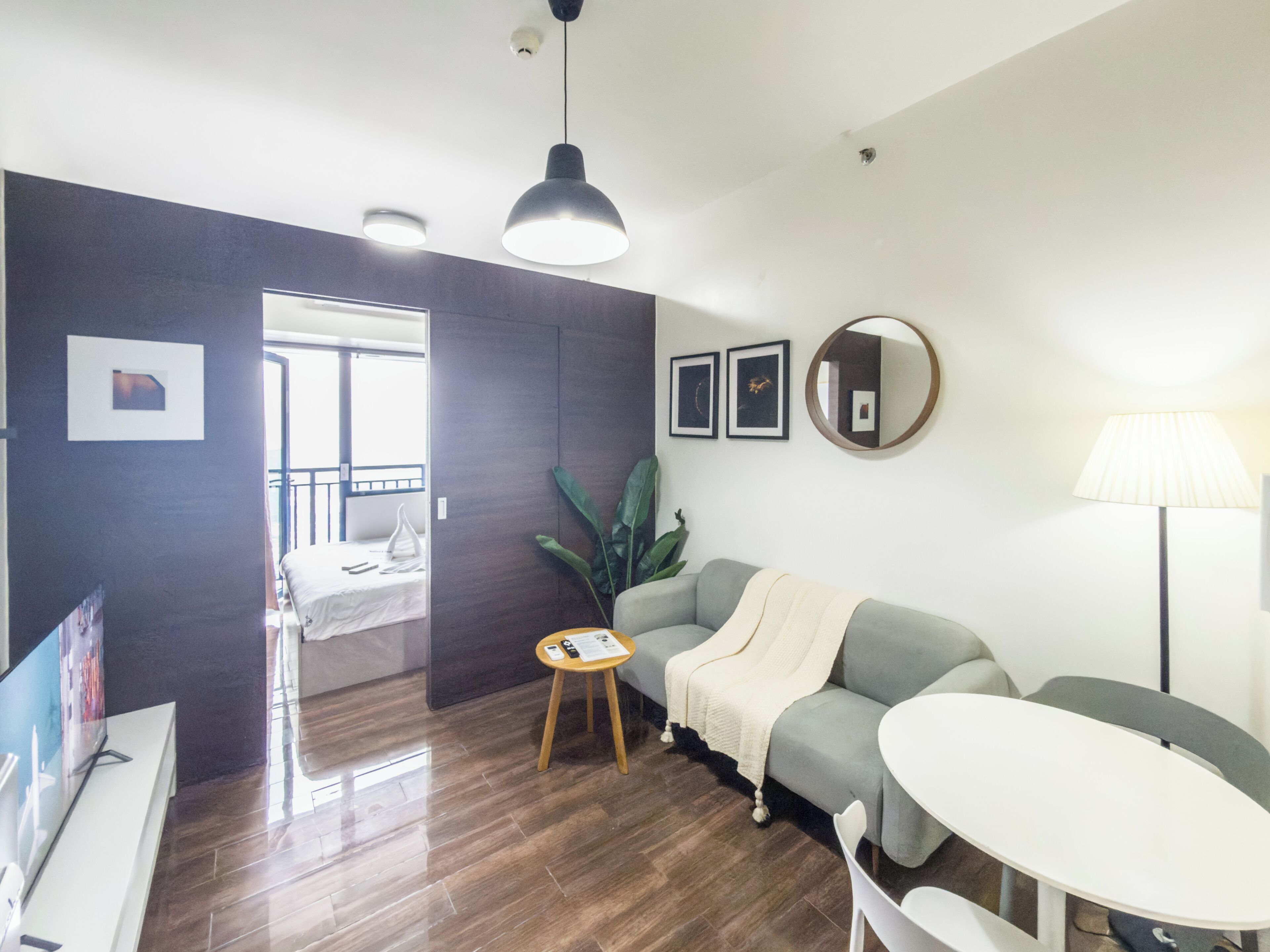 Signature Condo, Balcony, City View | Living area | Flat-screen TV