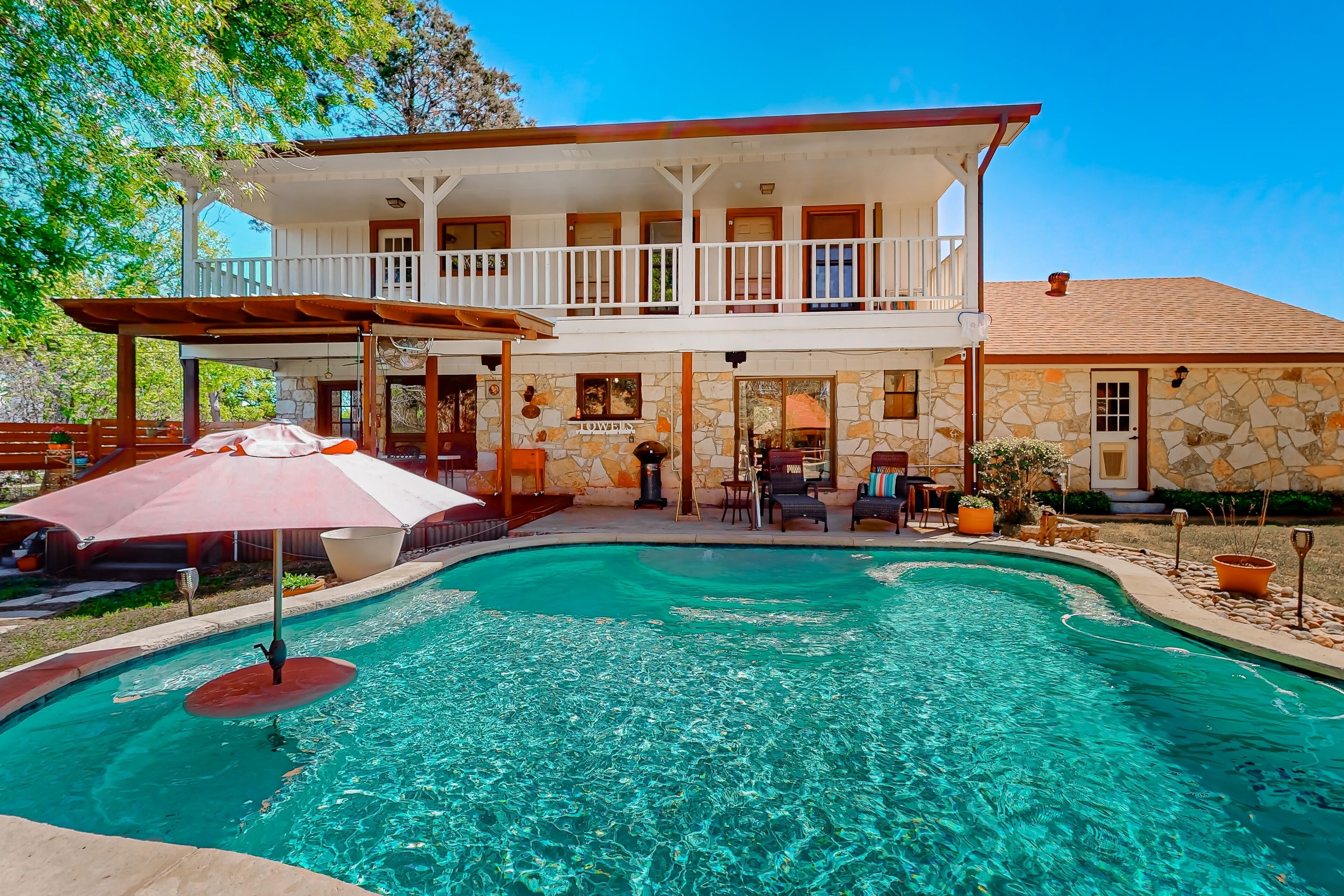 Spacious, quiet suburban home on two acres with backyard pool, balcony, & pond