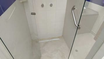 Shower, towels, soap, toilet paper