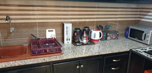 Fridge, microwave, stovetop, coffee/tea maker