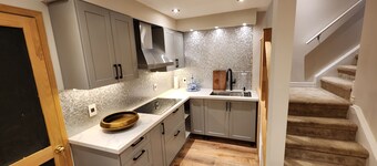 Cozy 2 bedroom basement with pool, jacuzzi, gym & sauna. Come see the chickens 