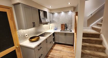 Cozy 2 bedroom basement with pool, jacuzzi, gym & sauna. Come see the chickens