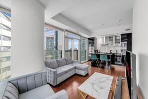 Junior Suite | Living area | 50-inch flat-screen TV with digital channels, streaming services - Elegant Suites - CN Tower & Lake View (Toronto)