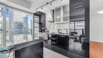 Junior Suite | Private kitchen | Full-size fridge, microwave, oven, stovetop