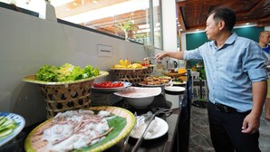 A buffet area with various food items and a salad station. - May Boutique Villa Hoi An (Da Nang)