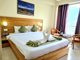 Desk, laptop workspace, blackout drapes, iron/ironing board