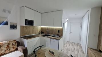 Mini-fridge, microwave, stovetop, electric kettle