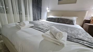 1 bedroom, laptop workspace, blackout curtains, iron/ironing board