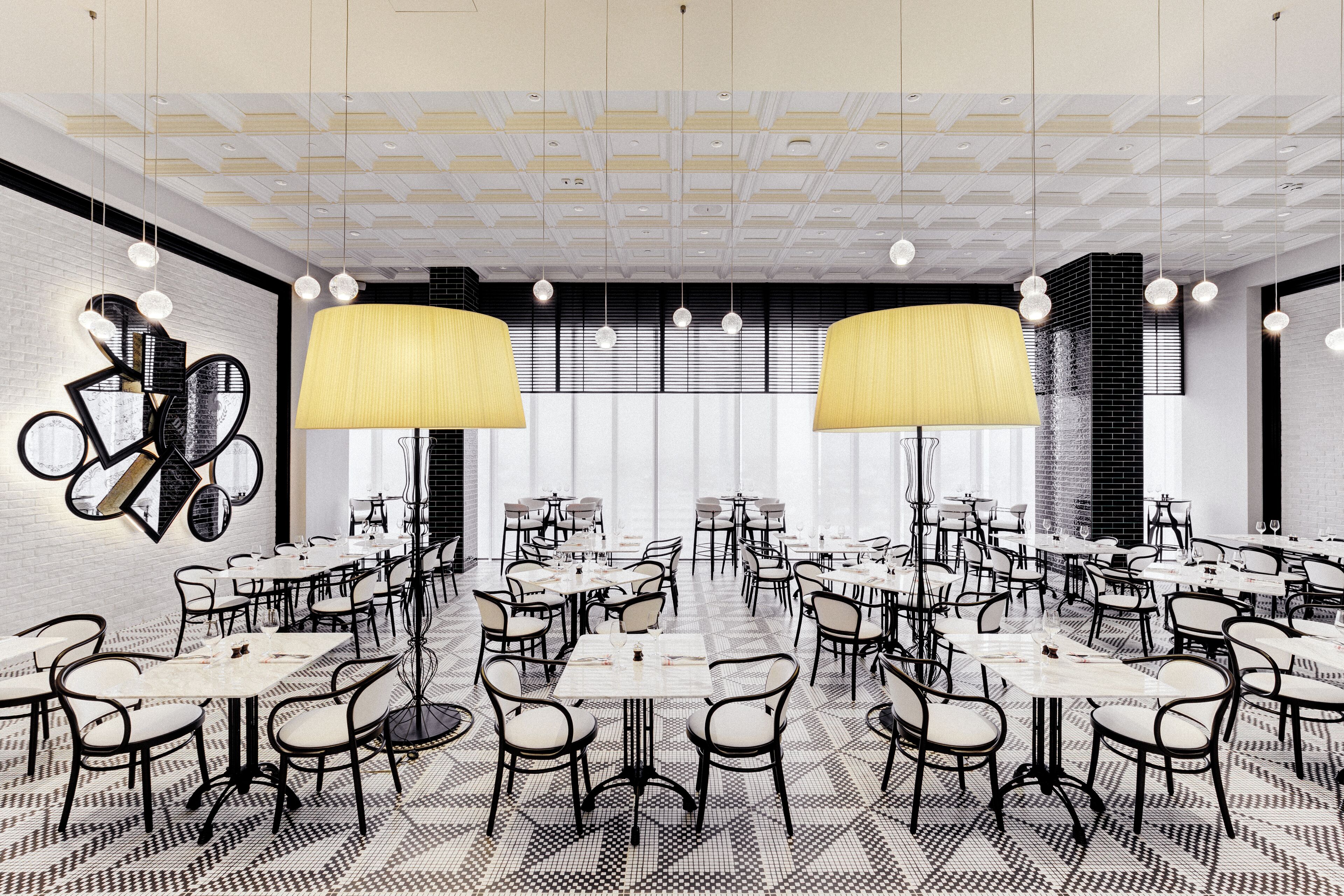 A spacious dining area with multiple tables and chairs, large lamps, and a patterned floor.