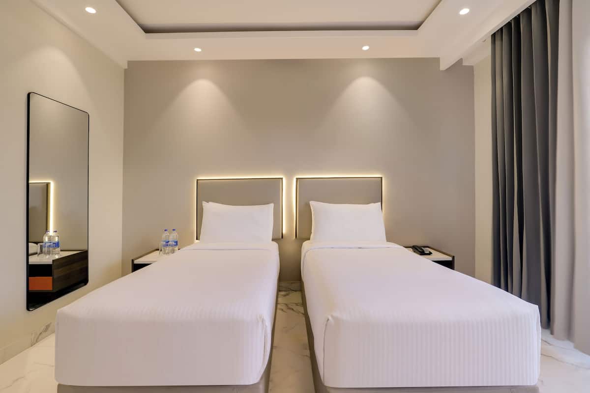 Chambre Exécutive avec lits jumeaux, balcon | 1 chambre, draps en coton égyptien, literie de qualité supérieure