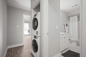 Shower, hair dryer, towels, shampoo