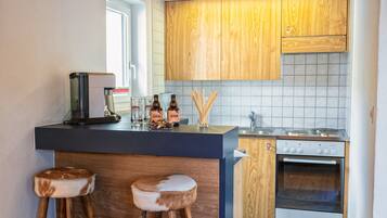 Fridge, oven, coffee/tea maker, cookware/dishes/utensils