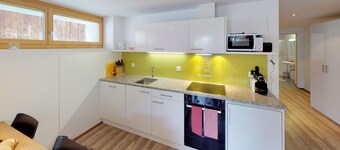 Chasa Samalgors: Moderne und familienfreundliche 3-Zimmerwohnung im idyllischen Bergdorf Tschlin