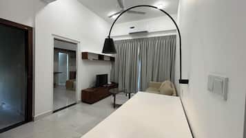 Apartment, City View | Living area | 32-inch Smart TV with digital channels