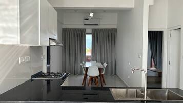 Apartment, City View | Private kitchen | Mini-fridge, cookware/dishes/utensils, kitchen islands