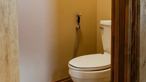 A bathroom with a toilet, a shower, and a tiled floor. - Luxury villa w/ lake+mtn views+private theatre! (Grand Lake)