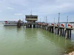 Guests can enjoy a serene waterfront view from the pier, which offers a boat dock and a lookout point.