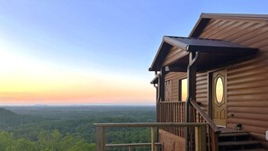 A wooden cabin with a balcony overlooking a forested valley. - Breathtaking Views!  Spacious Cabin, HotTub, pool table near PF & Gatlinburg ⛰️ (Sevierville)