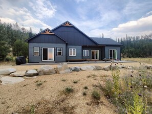 A modern two-story house with a dark exterior, large windows, and a covered patio area. - Cozy home with amazing views, close to Discovery Ski Area.

Pet Friendly
 (Anaconda)