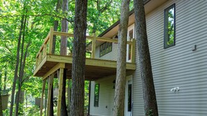 A two-story house with a wooden deck and a large tree in front. - Mammoth Cave, WKU, Barren River Lake, Travel Sports, Corvette (Bowling Green)