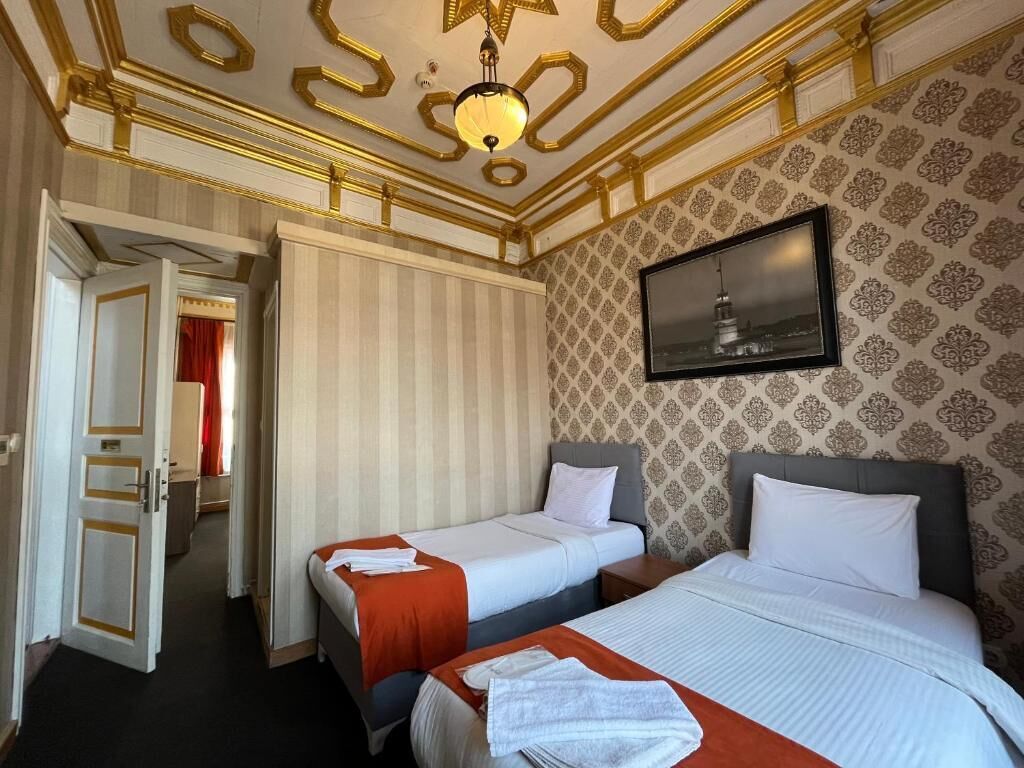 Family Quadruple Room | Premium bedding, minibar, laptop workspace, iron/ironing board