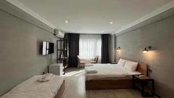 Deluxe Triple Room | Premium bedding, minibar, laptop workspace, iron/ironing board