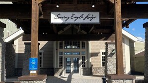 A building entrance with a sign reading "Soaring Eagle Lodge." - Soaring Eagle  311 Ski In Out (Snowshoe)
