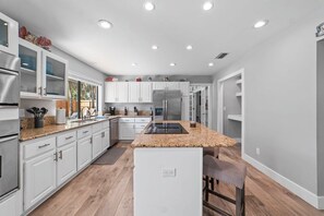 Fridge, microwave, oven, stovetop - Spacious retreat just minutes from the beach with a stunning pool and game rooms (Jacksonville Beach)