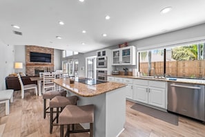 Fridge, microwave, oven, stovetop - Spacious retreat just minutes from the beach with a stunning pool and game rooms (Jacksonville Beach)