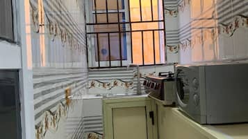 Apartment | Private kitchen | Fridge, microwave, stovetop, electric kettle