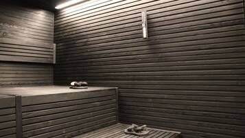 Una sauna con listones de madera en las paredes y bancos.
