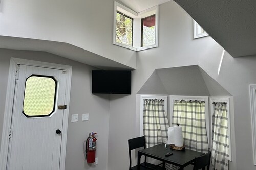 Train caboose with open floor plan, high ceilings & modern airy feel
