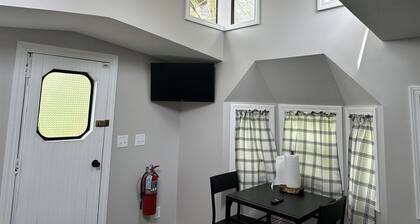 Train caboose with open floor plan, high ceilings & modern airy feel