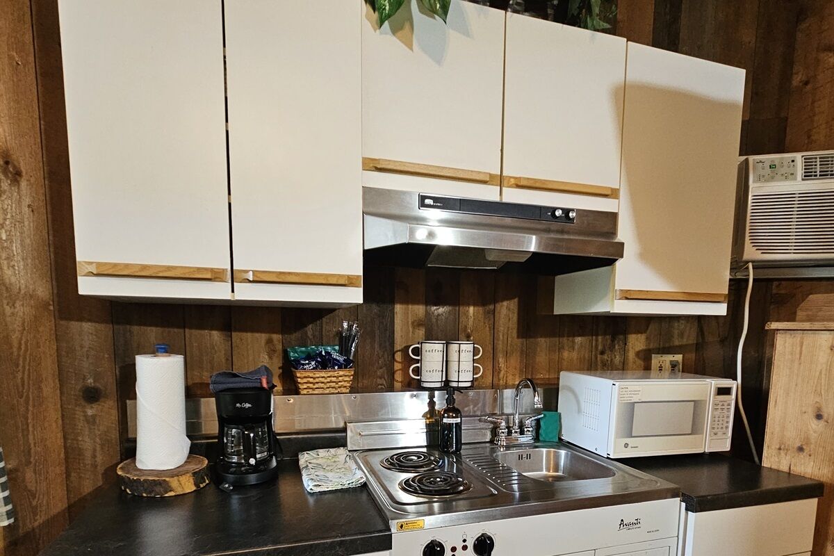 Coffee/tea maker, microwave, dining table