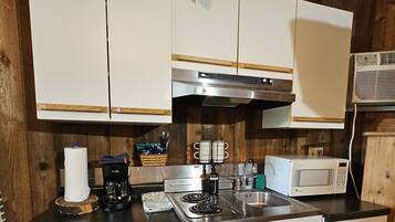 Coffee/tea maker, microwave, dining table