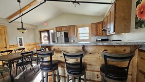 Dining - Elevated luxury awaits at Legacy Cabins, where bison roam just beyond. (Hanna City)