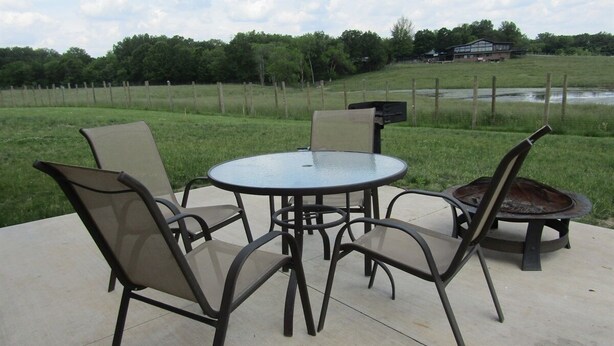 Outdoor dining - Elevated luxury awaits at Legacy Cabins, where bison roam just beyond. (Hanna City)