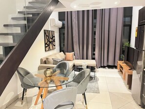 Luxury Apartment, 1 Bedroom, Non Smoking | Living area | 54-inch flat-screen TV with cable channels, Netflix, iPod dock