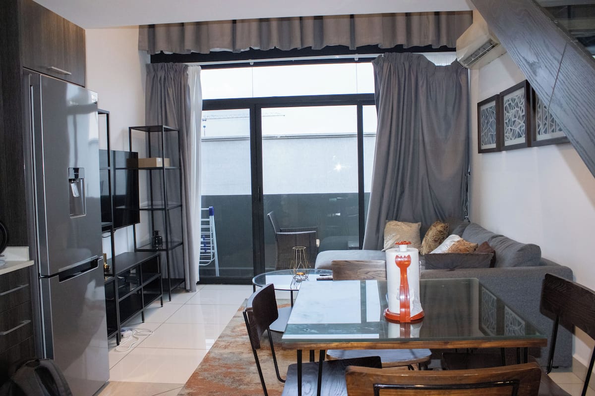Luxury Apartment, 1 Bedroom, Non Smoking | Living area | 54-inch flat-screen TV with cable channels, Netflix, iPod dock