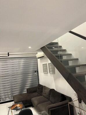 Luxury Apartment, 1 Bedroom, Non Smoking | Living area | 54-inch flat-screen TV with cable channels, Netflix, iPod dock