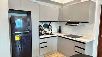 Fridge, microwave, stovetop, coffee/tea maker