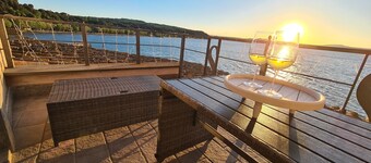 Two-room apartment located in private area of the village with exclusive terrace overlooking the lake